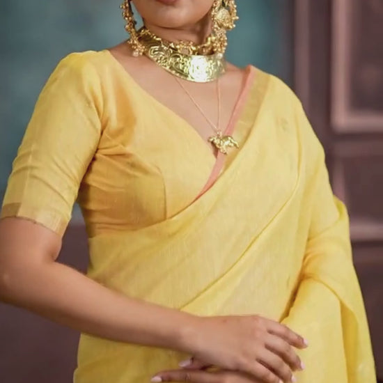 woman in yellow color saree with jewellery