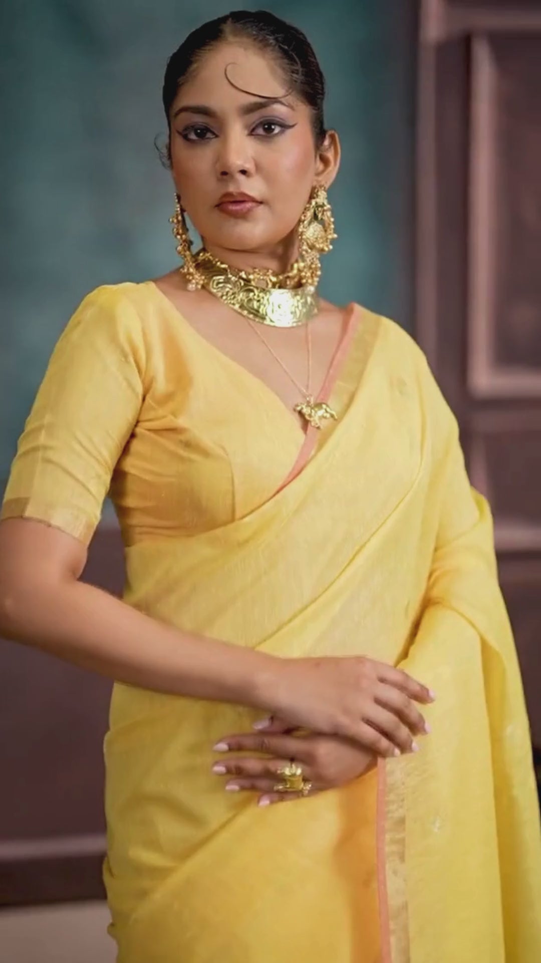 woman in yellow color saree with jewellery